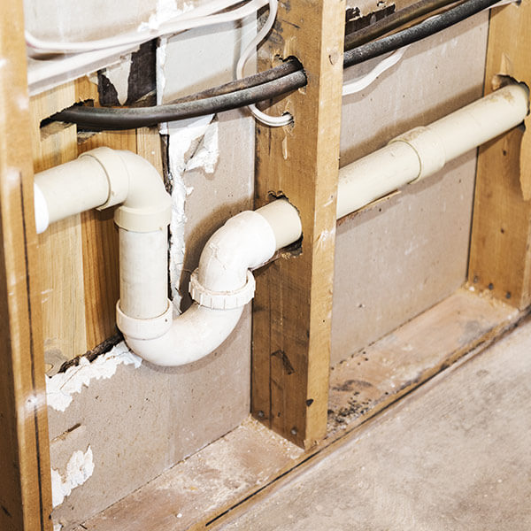 in-wall sewage pipes